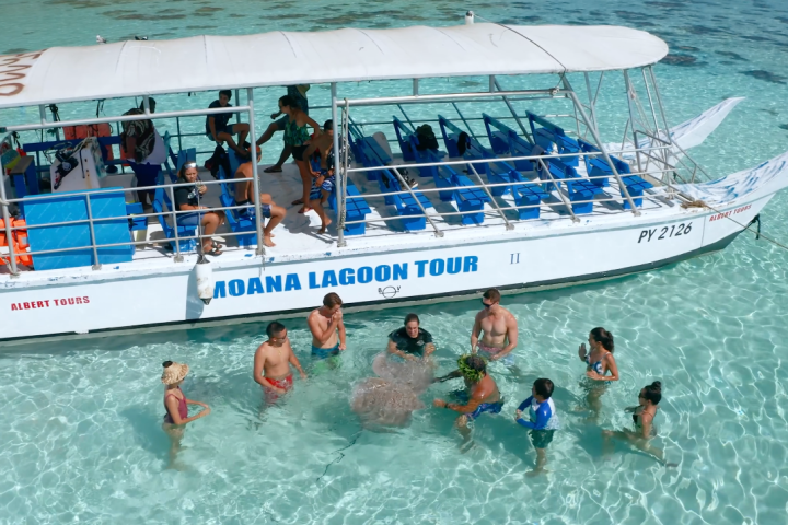 a group of people on a boat in the water