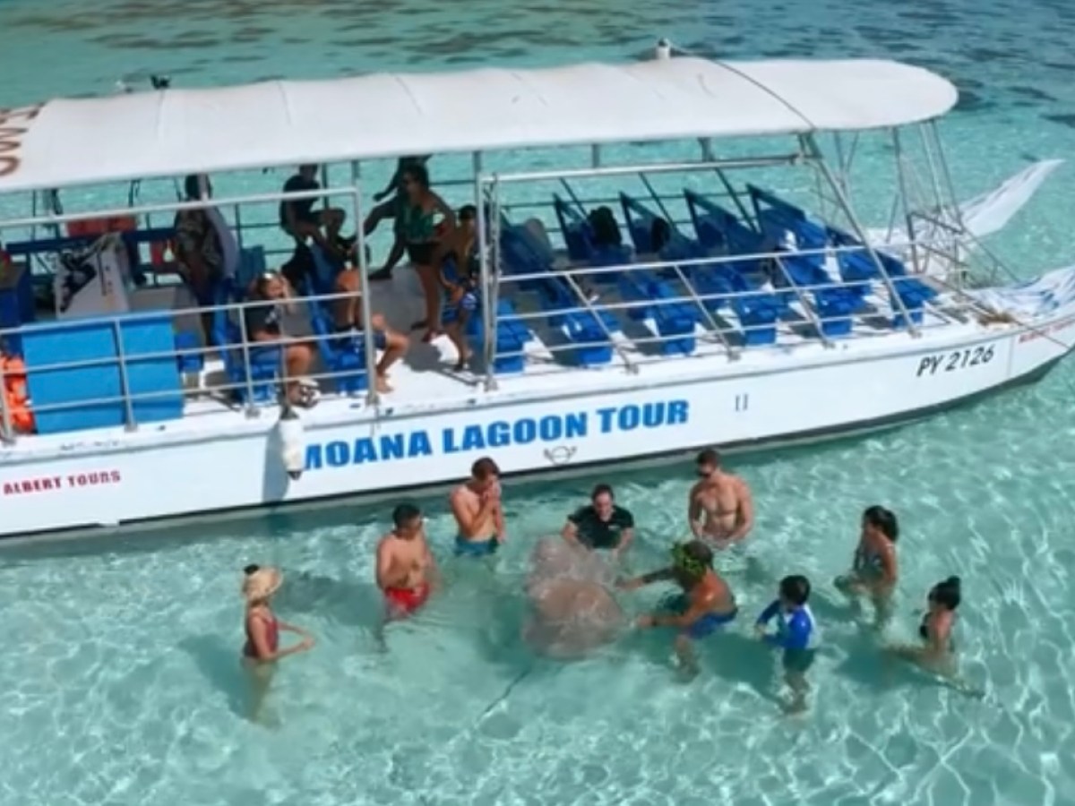 a group of people on a boat in the water