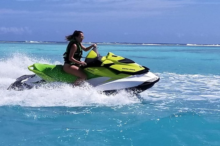 a girl riding a wave on a surfboard in the ocean