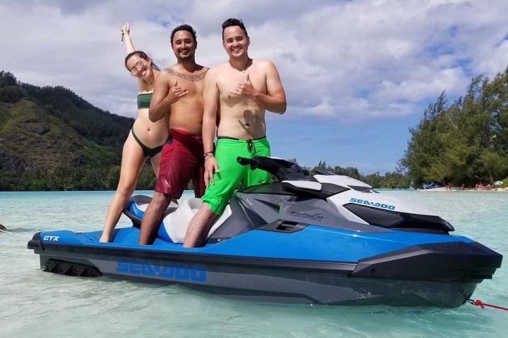 a man sitting in a boat on a body of water