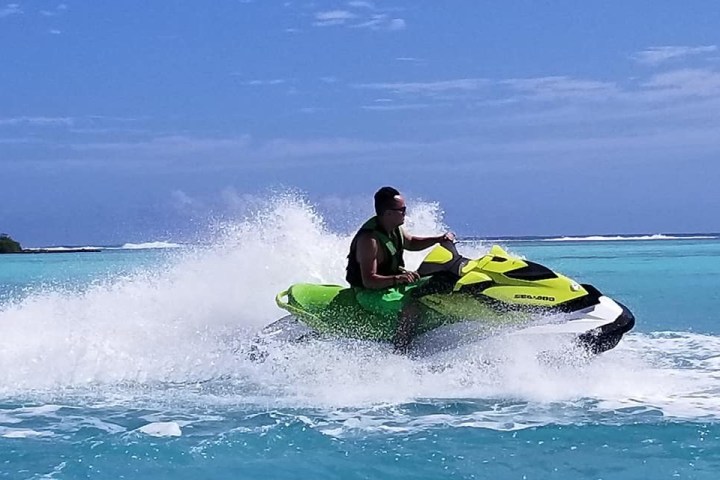 a man riding a wave on a surfboard in the ocean