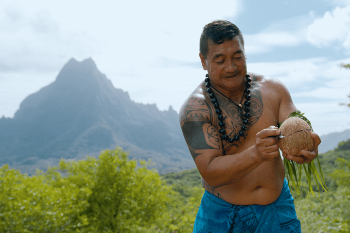a man standing in front of a mountain