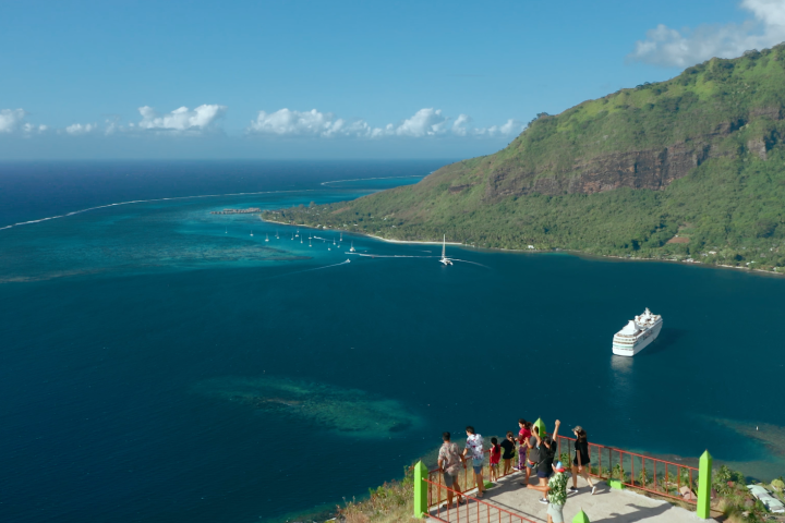 a view of a large body of water with a mountain in the background