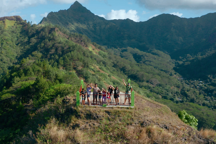 a group of people walking up a hill