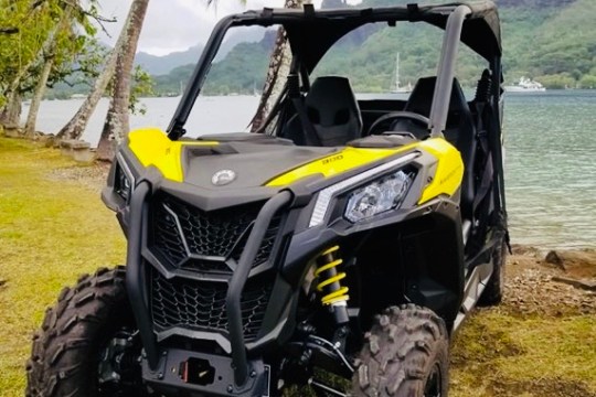 a motorcycle is parked on the side of a mountain