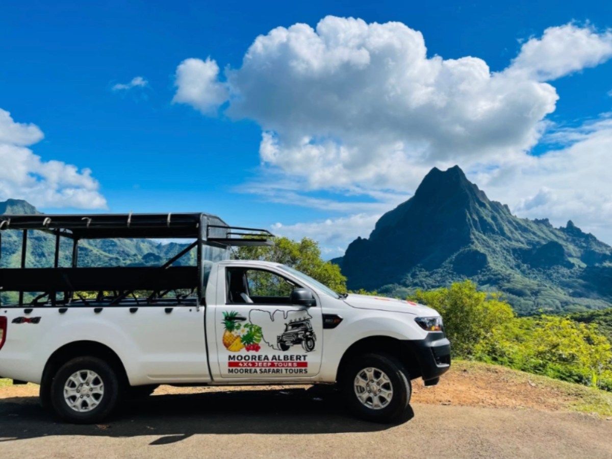 a car parked on the side of a mountain